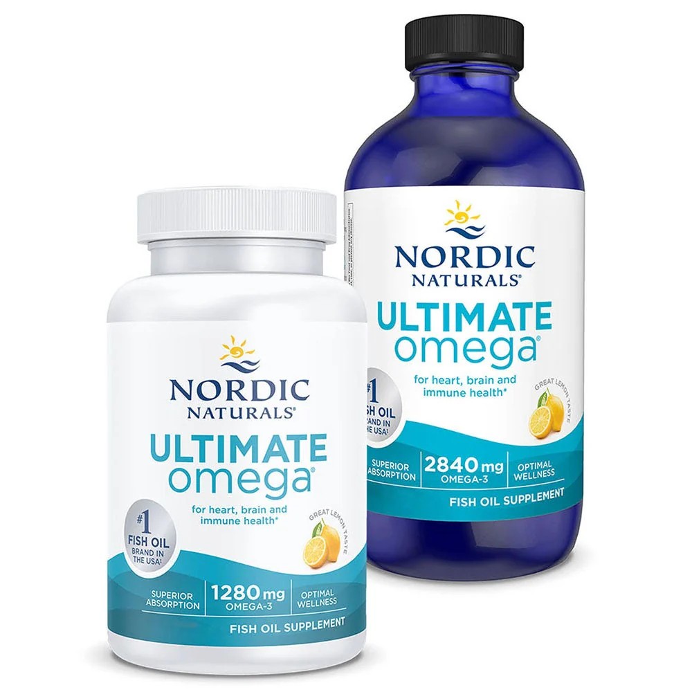 Nordic Naturals Ultimate Omega bottle with two soft gel capsules on a wooden countertop