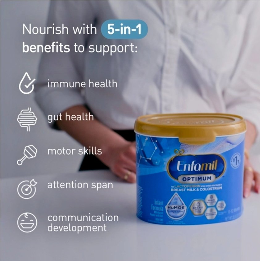 Close-up of Enfamil Optimum formula canister nutrition label on a kitchen counter with warm lighting