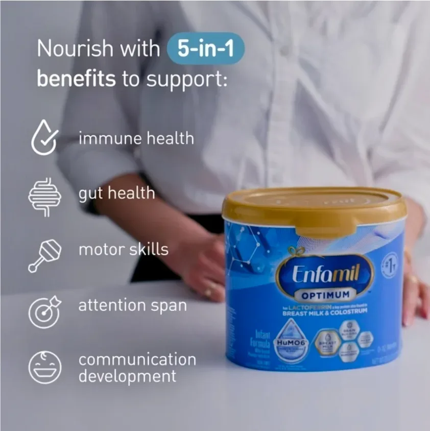 Enfamil Optimum powder formula can packed inside an open diaper bag outdoors on a park bench.