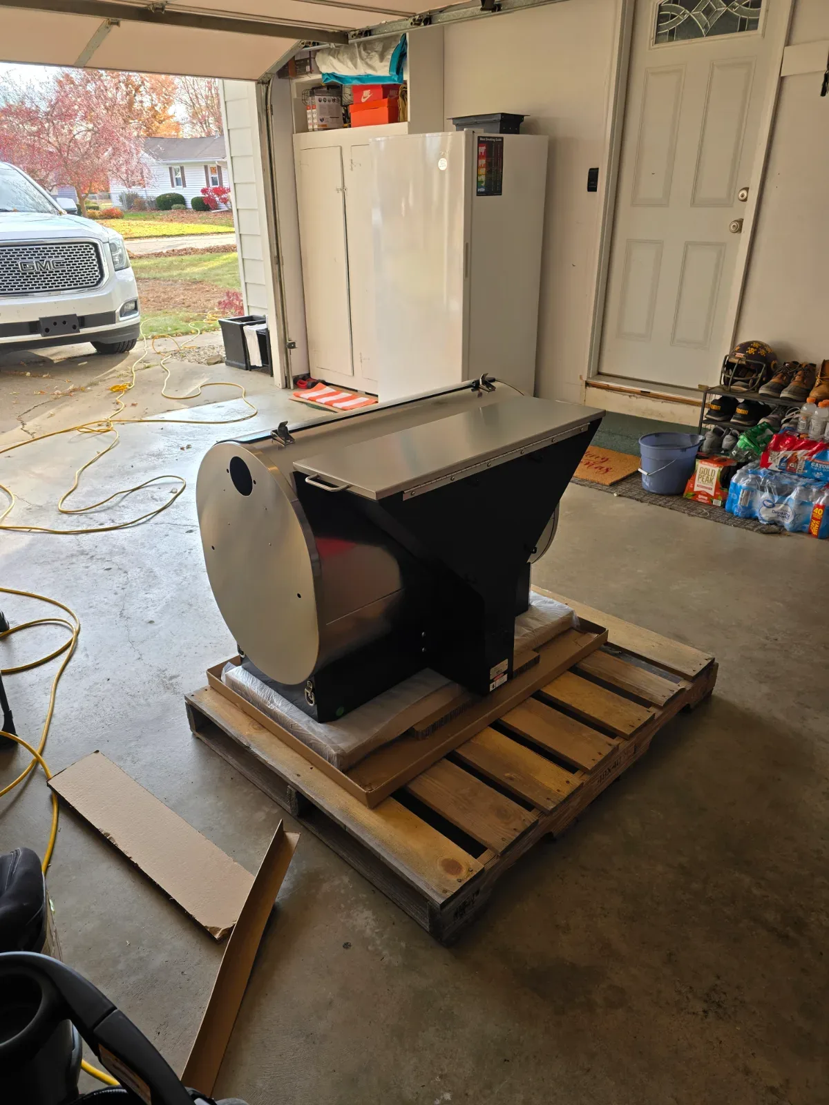 Open 40-pound pellet hopper of the Recteq RT-1600 filled with wood pellets, viewed from above