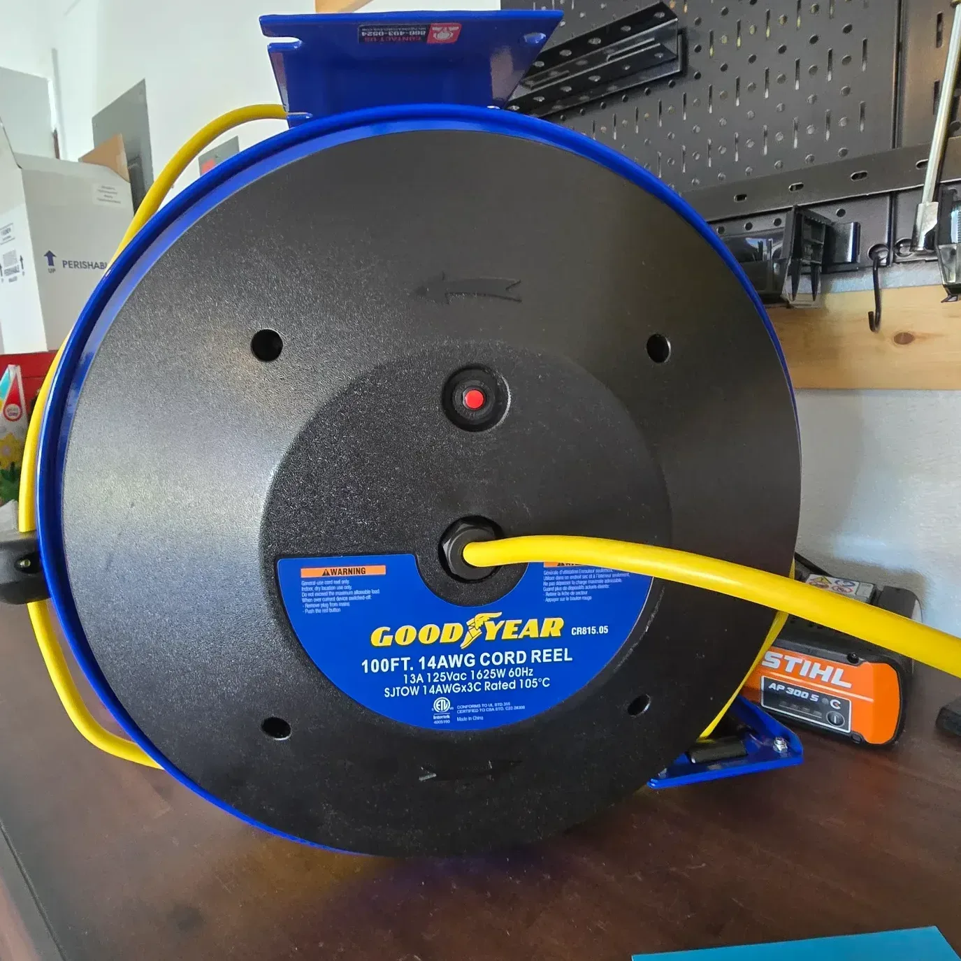 Triple-tap outlet head with illuminated LED power indicator on the Goodyear retractable cord reel