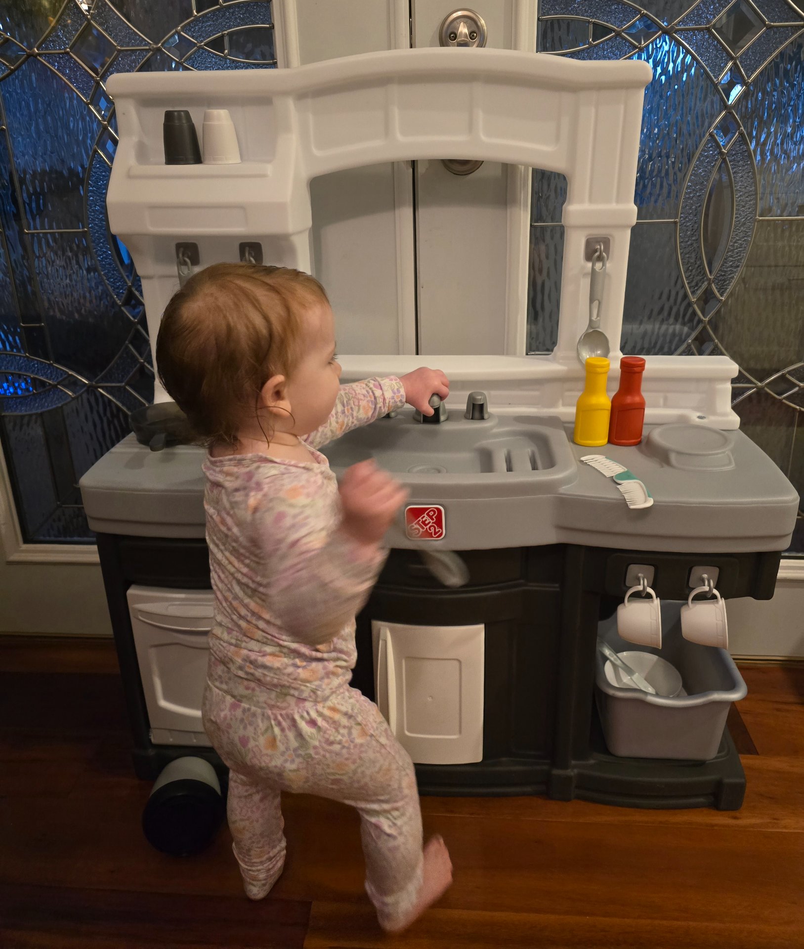 Step2 Modern Cook Stove Set with included pot resting on burner, shot from low toddler-eye-level angle