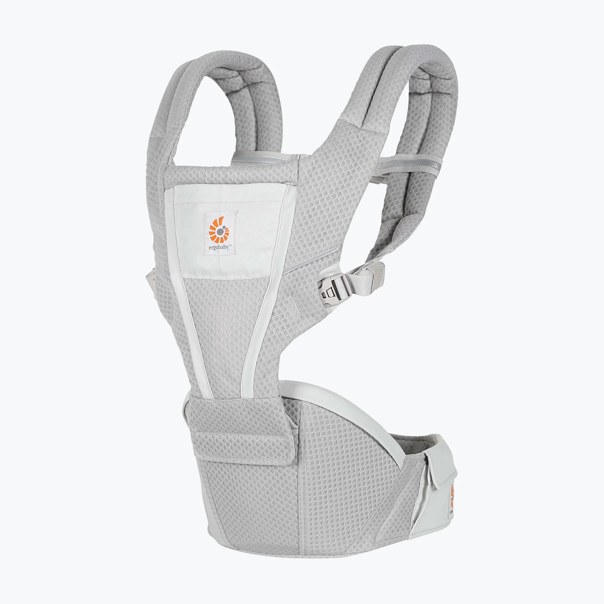 Ergobaby Alta Hip Seat Baby Carrier hanging on a hook near a front door with a diaper bag nearby
