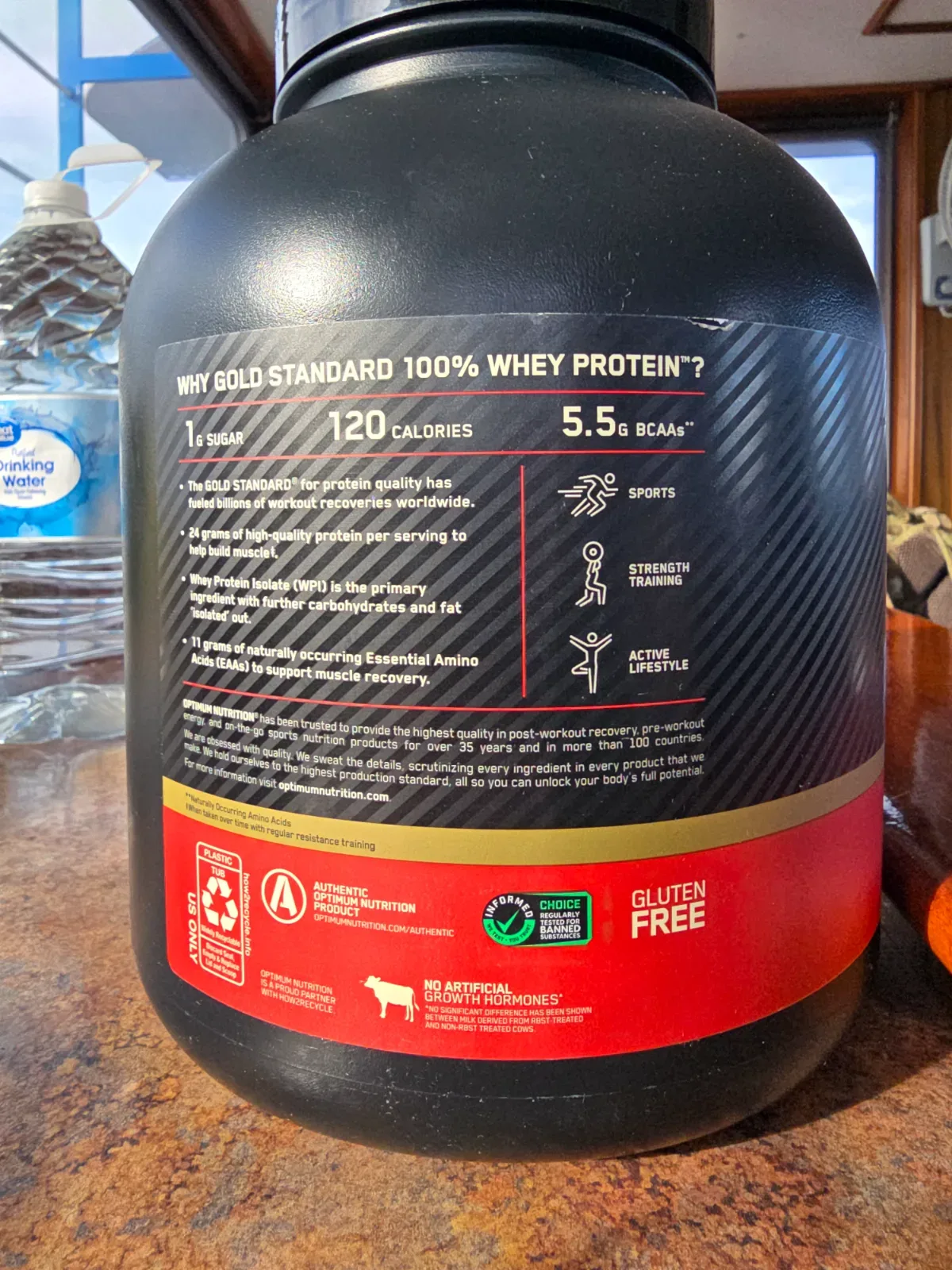 An open protein powder container showing the fine powder texture inside